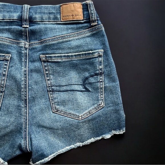 AE Next Level Stretch Curvy High Rise Shortie Distressed Denim Shorts - Picture 6 of 10